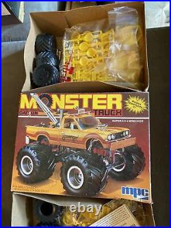 4 vintage 80s MPC and AMT monster truck, funny car model kits. Unused in box