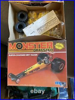 4 vintage 80s MPC and AMT monster truck, funny car model kits. Unused in box